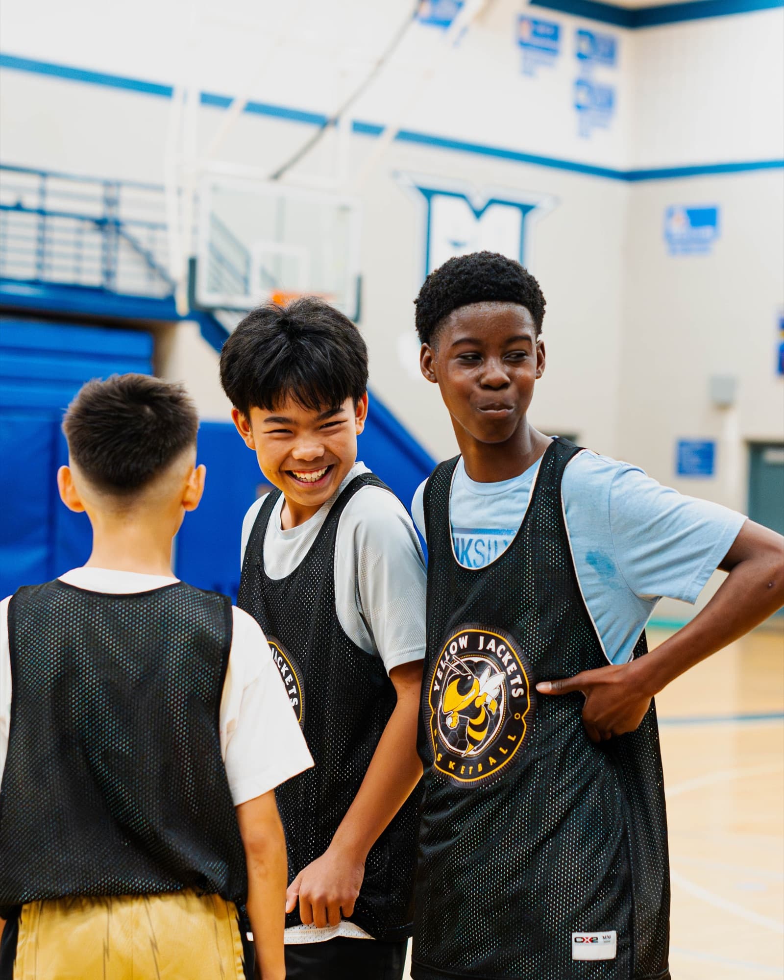 Two teammates side by side in the gym